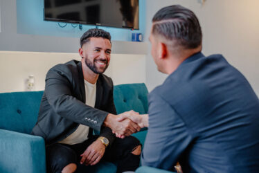 Two Men Shaking Hands in a Business Meeting