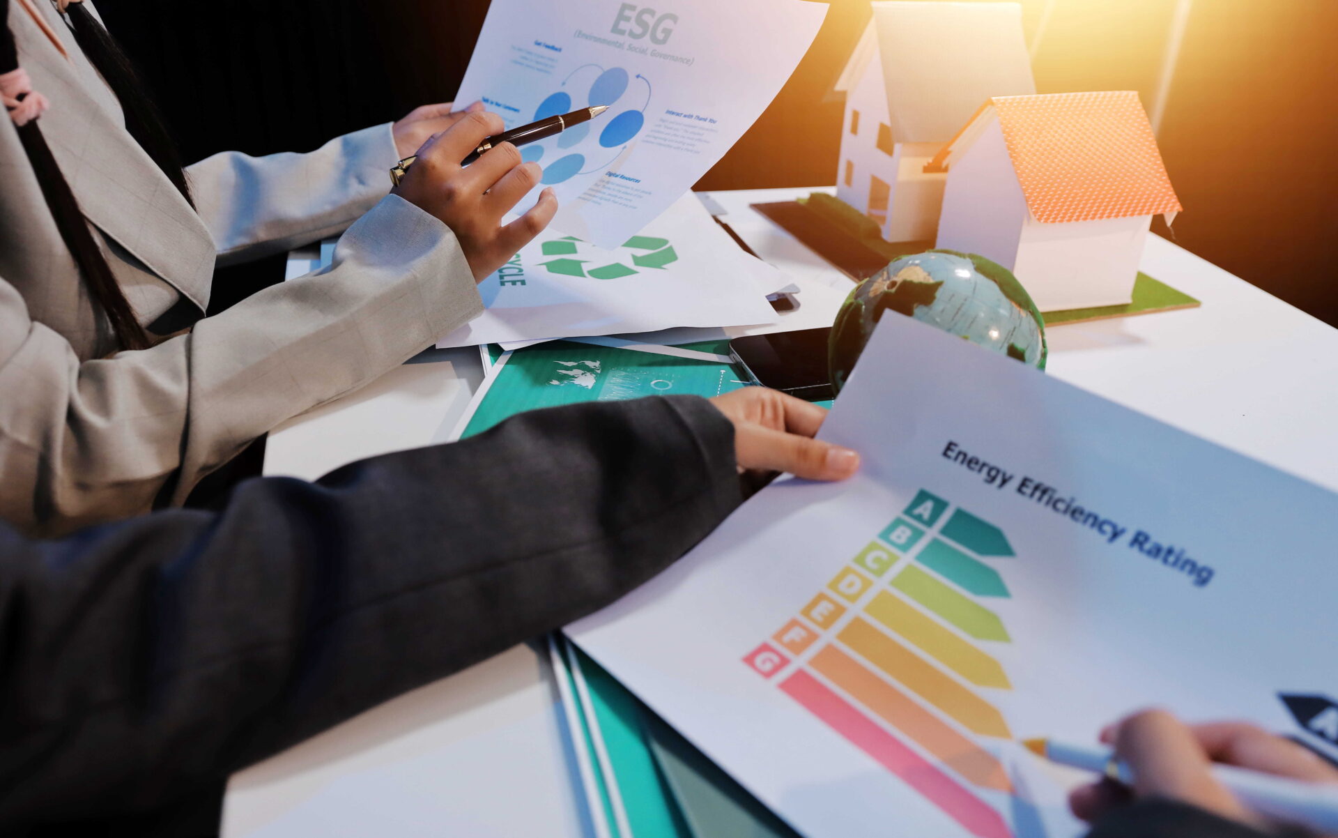 Business Team Reviewing Energy Efficiency Rating and ESG Report