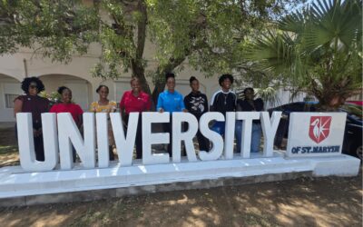 Students and Staff at the University of St. Martin Campus Signage