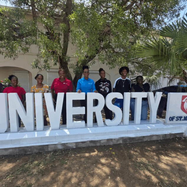 Students and Staff at the University of St. Martin Campus Signage