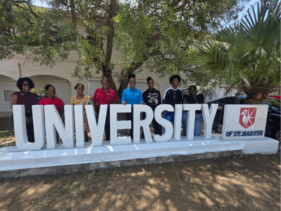 Students and Staff at the University of St. Martin Campus Signage
